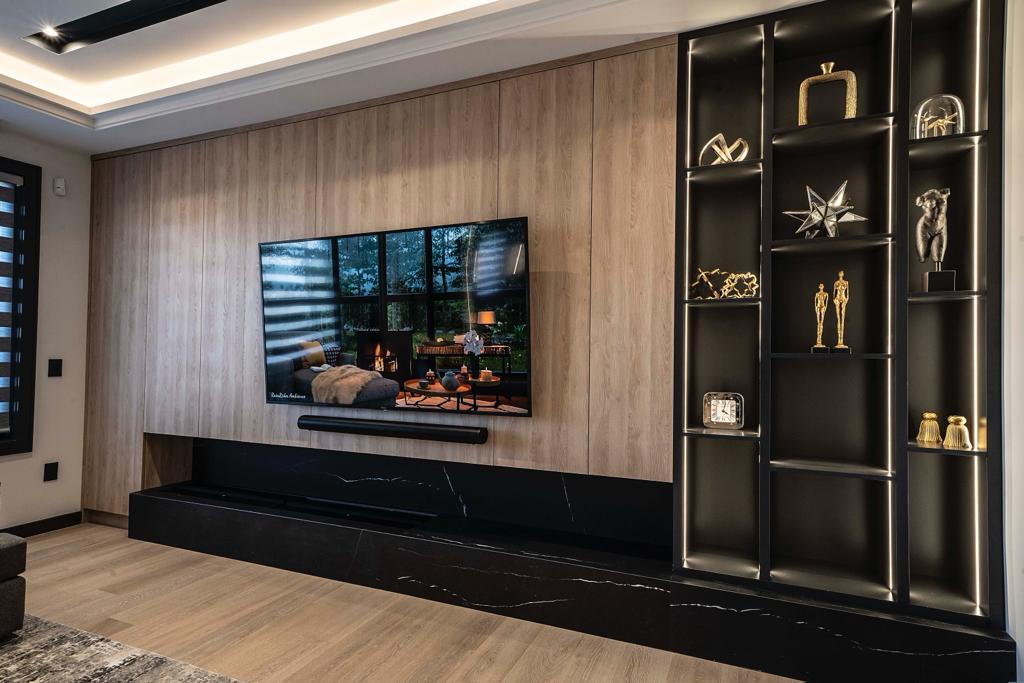 Walnut and black built-in media wall with illuminated display shelving — Wynne project