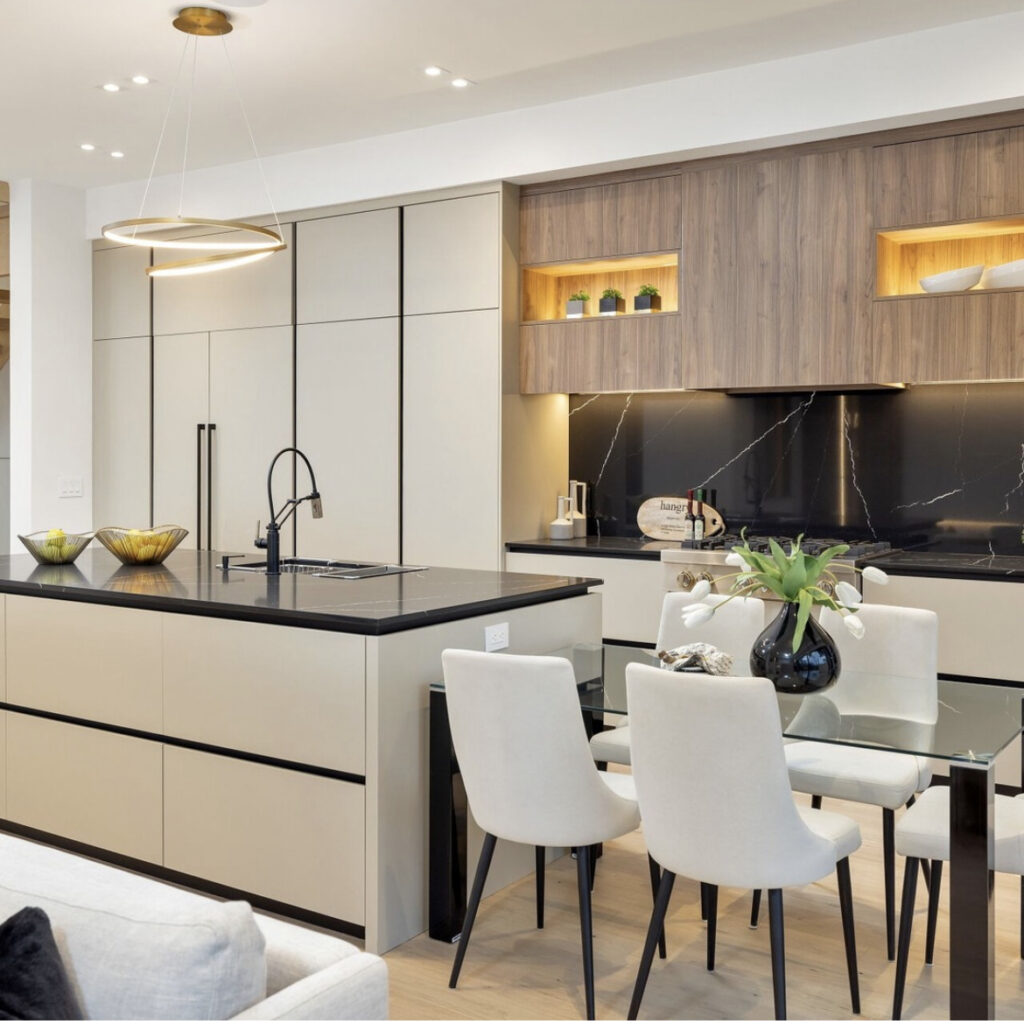 Cream and walnut kitchen with black stone counters and illuminated display niches — Denvail project
